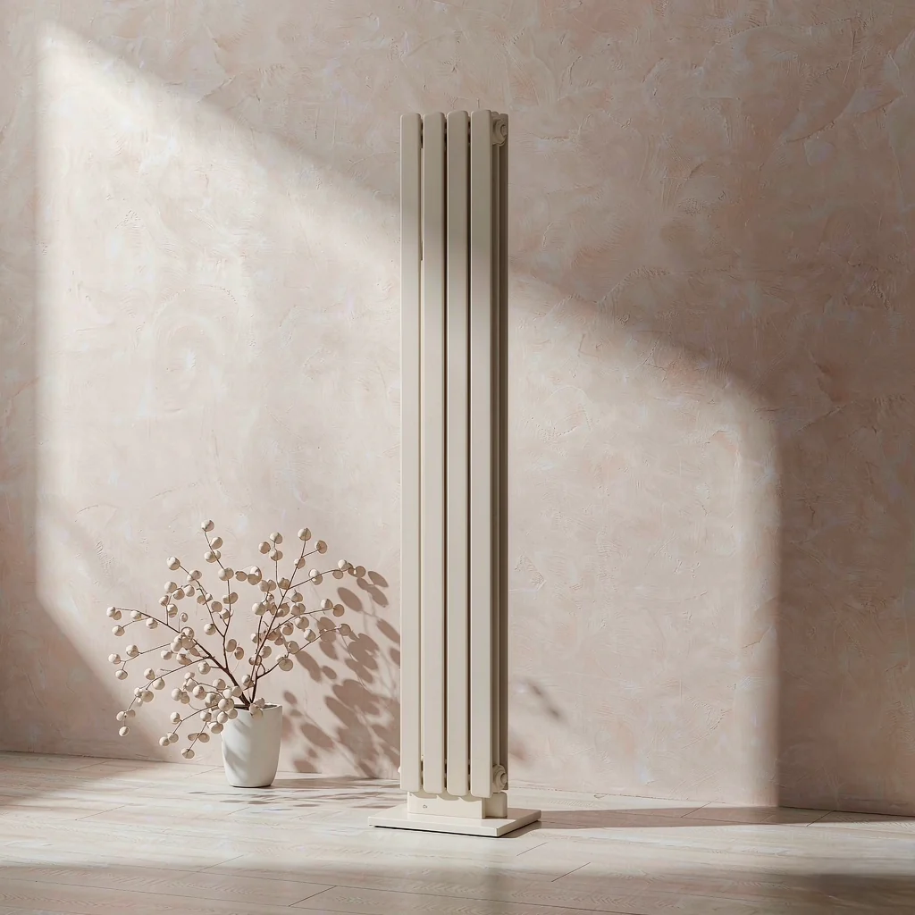 Slim off-white oil-filled column radiator against a pale plaster wall
